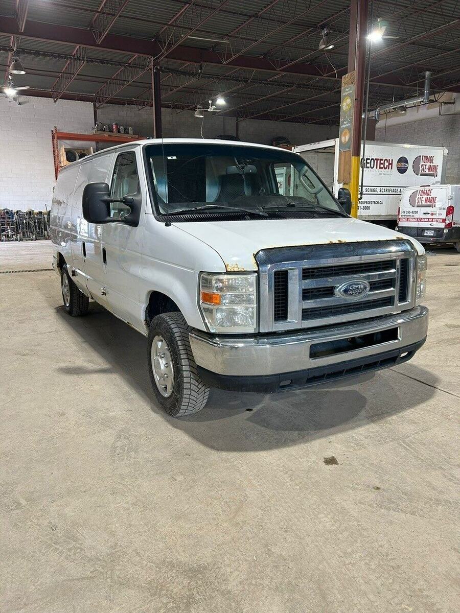 Front three-quarter view of the Ford E-150 cargo van