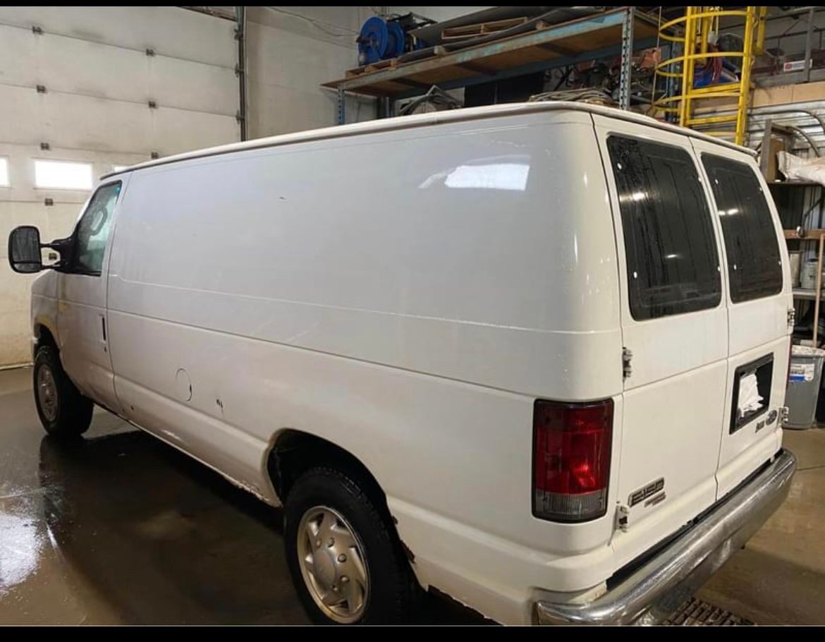 Rear three-quarter view of the Ford E-150 cargo van