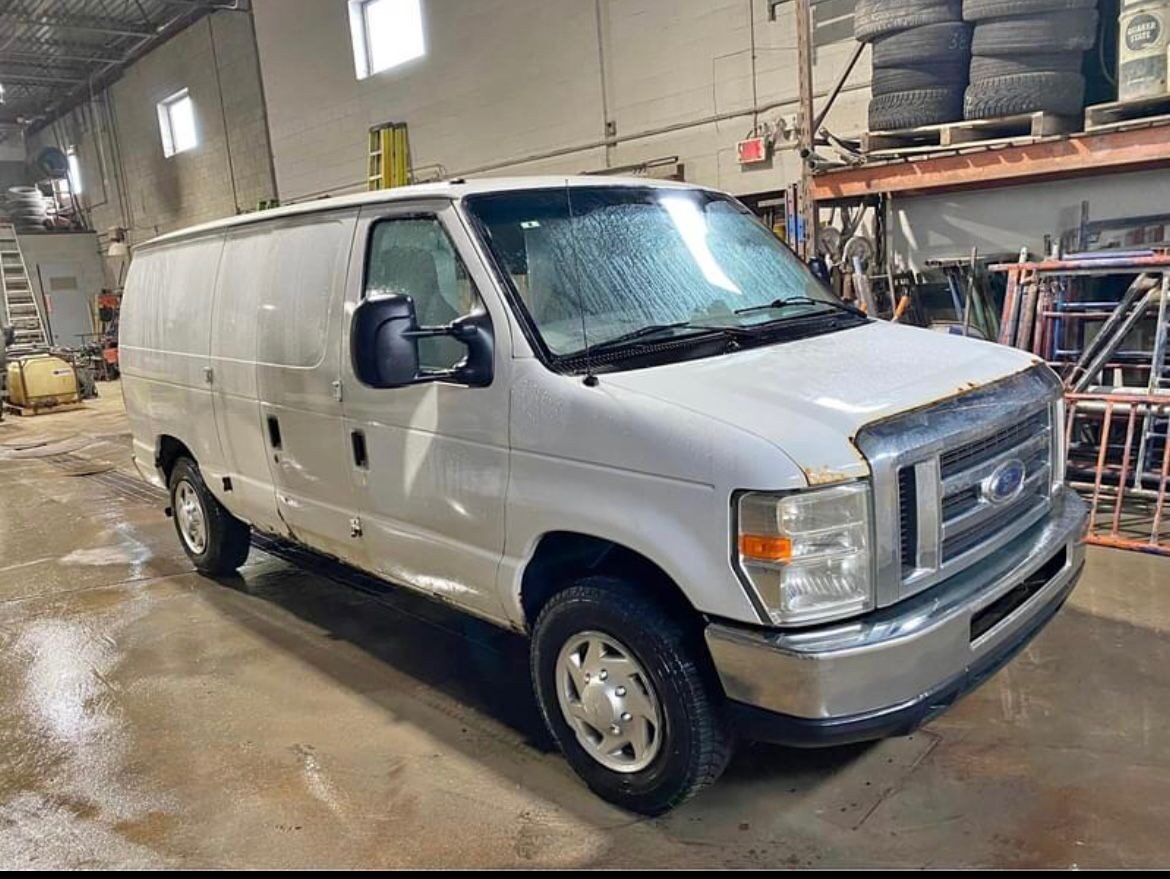 Ford E-150 full-size cargo van in the VG Well-Being Transport fleet