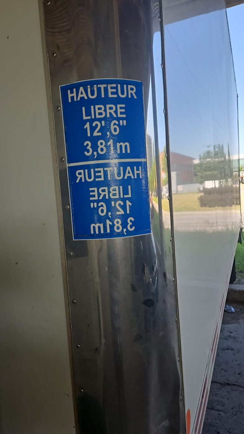 Clearance height decal showing 12 feet 6 inches, 3.81 metres
